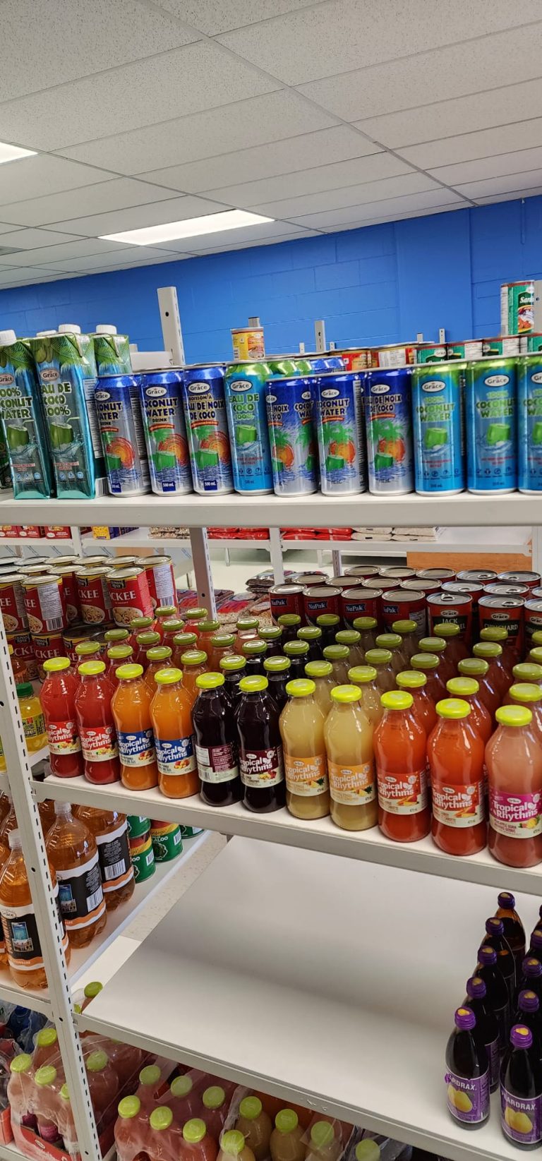 Close up shot of drinks on the shelves of Sunshine Grocers West Indian Store